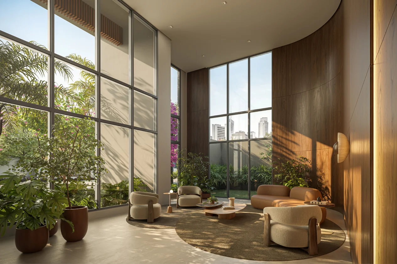 Lobby com pé-direito duplo, grandes panos de vidro, poltronas e acabamentos naturais.
